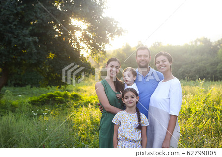Parents with children in countryside outdoors Parents with children in countryside outdoors 62799005