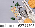 Cotton bags, glass jar, bottle, metal cup, straws for drinking, bamboo cutlery and boxes on gray background. Sustainable lifestyle. Zero waste, plastic free shopping concept. 62799808