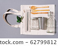 Fabric bags, glass jars, metal straws, bamboo cutlery on grey background with copy space. Eco friendly and reuse concept. Top view. Flat lay. Zero waste concept. 62799812