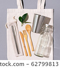 Fabric bags, glass jars, metal straws, bamboo cutlery on grey background with copy space. Eco friendly and reuse concept. Top view. Flat lay. Zero waste concept 62799813