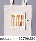 Eco friendly bamboo cutlery set, canvas shopping bag on grey background. Zero waste, plastic free concept 62799820