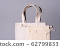 Reusable textile bag on gray background. Zero waste concept with copy space. Zero waste, plastic free concept. Top view. Eco friendly mesh shopper. 62799833