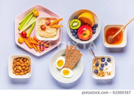 Healthy snack on a pastel background. 62800367