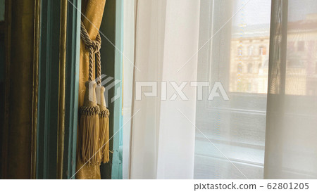 Curtain with warm sunlight close-up Curtain with warm sunlight close-up 62801205