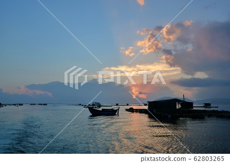 Morning on the bay of Van Phong, Khanh Hoa, Vietnam with the floating house and fisher boat 62803265