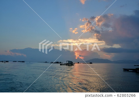 Morning and sunrise on the bay of Van Phong, Khanh Hoa, Vietnam with the floating house and fisher boat 62803266