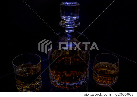 Decanter glass whisky black background blue light 62806005
