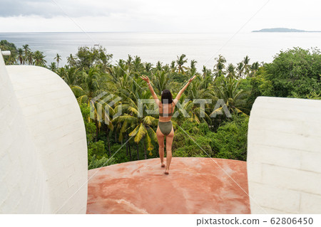 Female vacationist being in a harmonious state of mind Female vacationist being in a harmonious state of mind 62806450