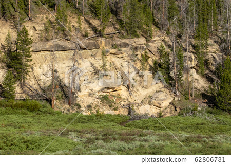 A sign on the side of a mountain 62806781