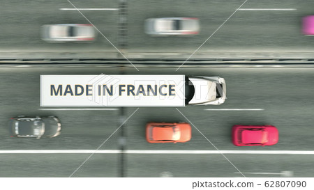 Aerial overhead view of semi-trailer truck with MADE IN FRANCE text driving along the road. French business related 3D rendering Aerial overhead view of semi-trailer truck with MADE IN FRANCE text driving along the road. French business related 3D rendering 62807090
