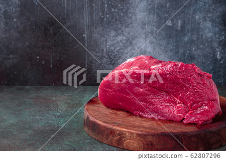 Raw beef on chopping deck Raw beef on chopping deck 62807296