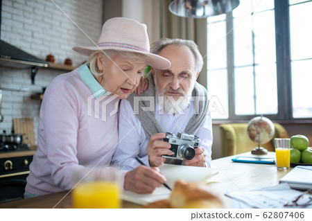 Elderly man and woman deciding on their upcoming travel 62807406
