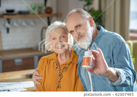 Elderly married good-looking couple demonstrating healthy lifestyle Elderly married good-looking couple demonstrating healthy lifestyle 62807465