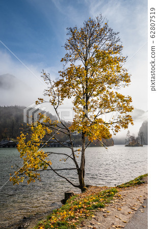 Mountain alpine autumn misty morning lake 62807519