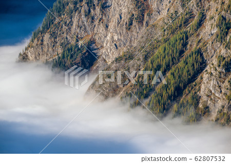 Autumn Alps mountain misty morning view from Autumn Alps mountain misty morning view from 62807532