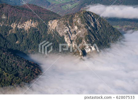 Autumn Alps mountain misty morning view from Autumn Alps mountain misty morning view from 62807533