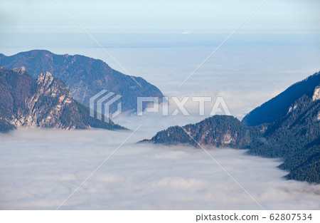 Autumn Alps mountain misty morning view from Autumn Alps mountain misty morning view from 62807534