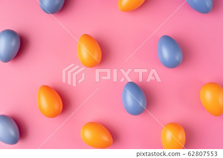 Colorful Easter Eggs on bright pink background Colorful Easter Eggs on bright pink background 62807553