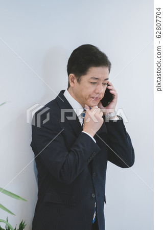 business smartphone call 50s businessman s sore throat 62807704