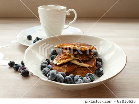Low Carb Keto Diet Pancakes from almond coconut flour with blueberries, cream and cup of cocoa Low Carb Keto Diet Pancakes from almond coconut flour with blueberries, cream and cup of cocoa 62810626