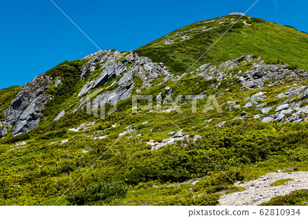 Climbers going on the rocky shores of Mt. Climbers going on the rocky shores of Mt. 62810934