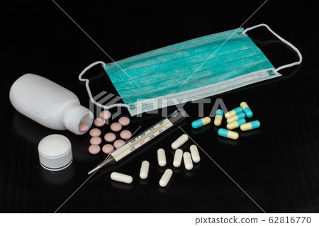 Face mask, mercury thermometer and different pills 62816770