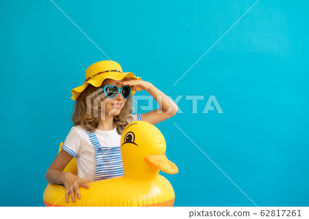Portrait of happy child with yellow rubber duck Portrait of happy child with yellow rubber duck 62817261