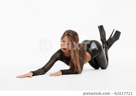 Attractive charming woman in leather suit and high Attractive charming woman in leather suit and high 62817721