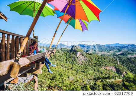 The girl sitting eating noodle in the rural village hanging legs style for viewpoint  62817769