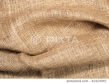 Crumpled burlap textile, close up view. Brown 62824945