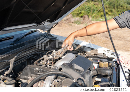 The driver is checking the car before traveling, safety first concept 62825251