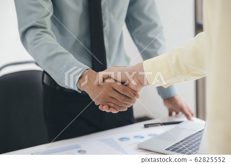Businessmans handshake after good deal. Businessmans handshake after good deal. 62825552