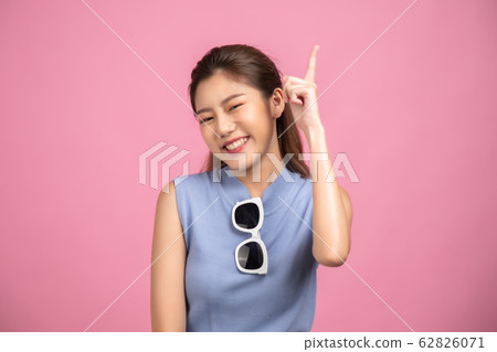 Thinking asian woman stand up  isolated on white 62826071