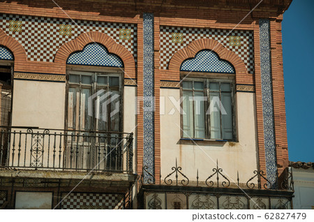 Doors to balcony on building with ceramics tiles in Merida 62827479