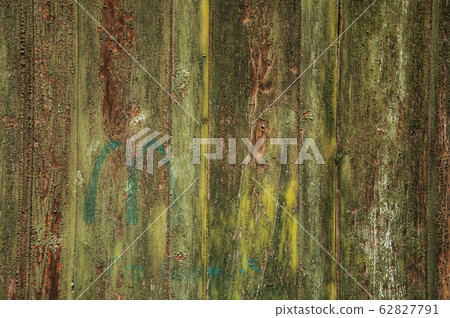 Worn planks of wood in an old door 62827791