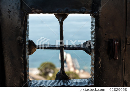 Antique metal window at the gates of the Genoese 62829068