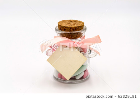 Colorful sweet almonds in a glass container with a Colorful sweet almonds in a glass container with a 62829181