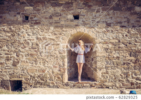 beautiful woman in a fashionable summer dress in beautiful woman in a fashionable summer dress in 62829325