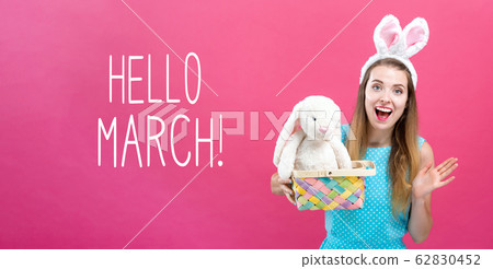 Hello March message with woman with Easter basket 62830452