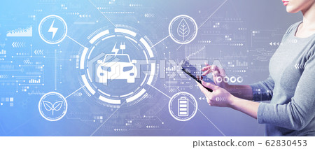 EV concept with woman using a tablet 62830453