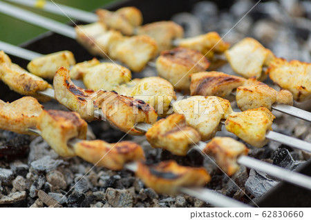 cooking meat on fire 62830660