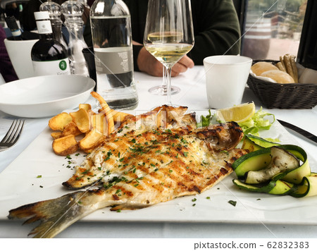 grilled fish dish sea bream restaurant service grilled fish dish sea bream restaurant service 62832383