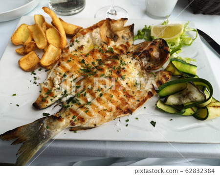 grilled fish dish sea bream restaurant service 62832384