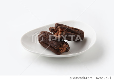Chocolate donuts on a plate white background 62832391