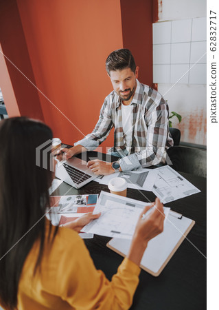Young man working with laptop and documents 62832717