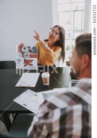 Two designer are looking up in office 62832722