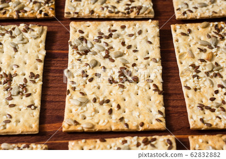 row of cookies crispy wheat cakes with sesame 62832882