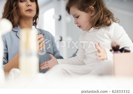Happy cute lady spending time with kid in the morning Happy cute lady spending time with kid in the morning 62833332