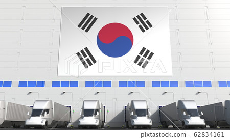 Trailer trucks at warehouse loading dock with flag of SOUTH KOREA. South Korean logistics related conceptual 3D rendering 62834161