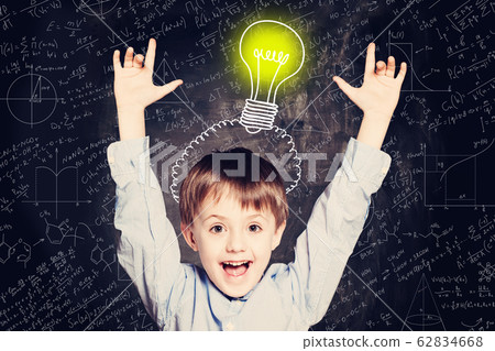 Child boy with hands up and lightbulb. Child boy with hands up and lightbulb. 62834668